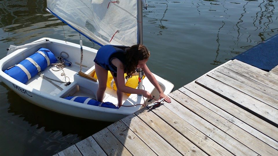 student docking sailboat